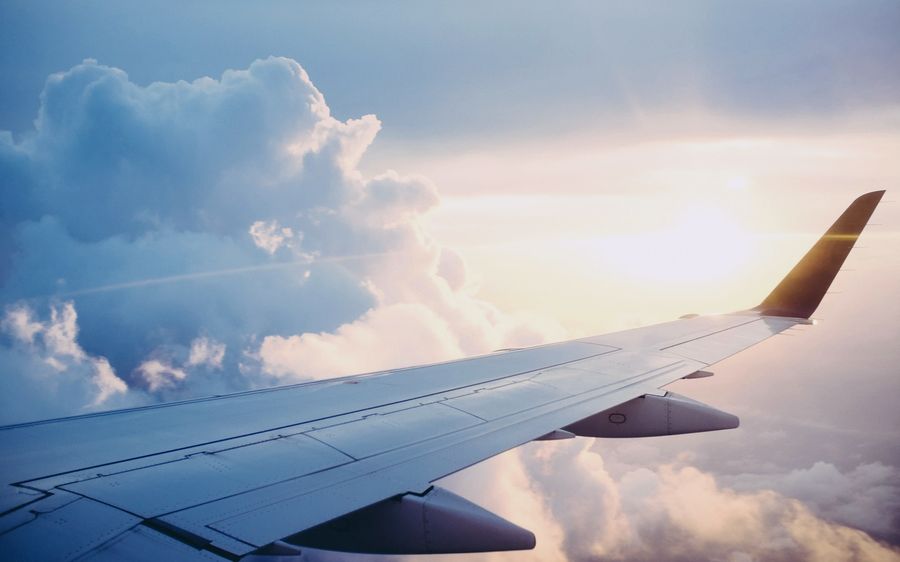 Cargo plane wing above the clouds