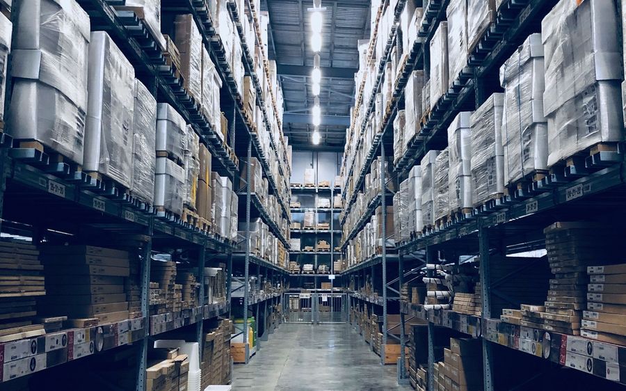 Warehouse aisle with stacked pallets